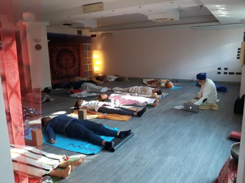 a group of people laying on the floor in a room at Hotel Il Duca d'Este in Ferrara