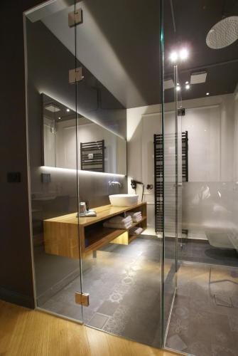 a bathroom with a sink and a mirror at Fingerprint Tree Apartments - Delux in Zagreb