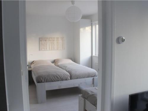 Ένα ή περισσότερα κρεβάτια σε δωμάτιο στο Vakantiewoning 71