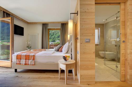 Ένα ή περισσότερα κρεβάτια σε δωμάτιο στο Active Hotel Monte Giner