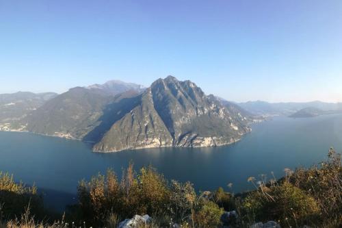 a view of a large body of water with mountains at Villa Daniela in Riva di Solto