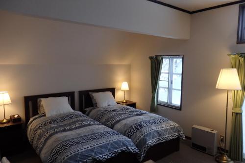 Ένα ή περισσότερα κρεβάτια σε δωμάτιο στο Anri