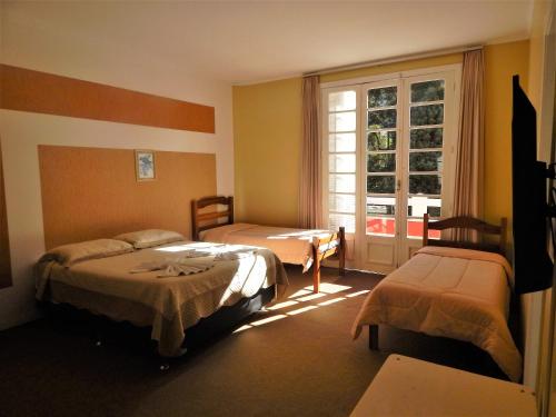 Cama ou camas em um quarto em Hotel Platanus