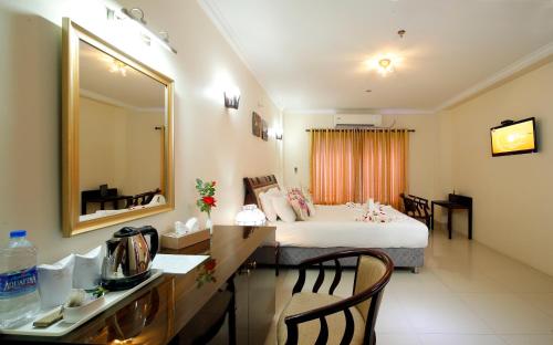 Katil atau katil-katil dalam bilik di Rose International Hotel