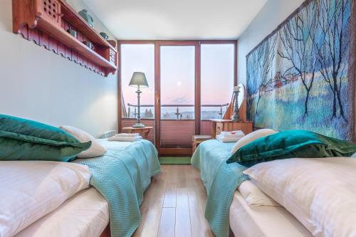 Posteľ alebo postele v izbe v ubytovaní Apartament Bajeczna Góra Zakopane