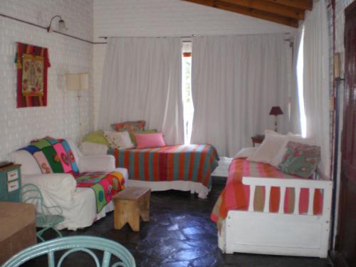 A bed or beds in a room at La Posada de Agustina