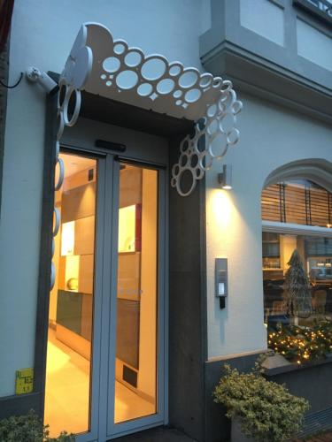a door of a building with a security camera at ABC Hotel in Blankenberge