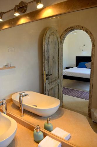 a bathroom with a sink and a large mirror at Red C Villas in Dahab