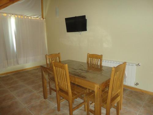 TV a/nebo společenská místnost v ubytování Unquehue Apartamentos Dormis