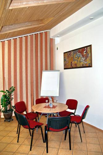 a meeting room with a table and chairs at City Gate in Vilnius