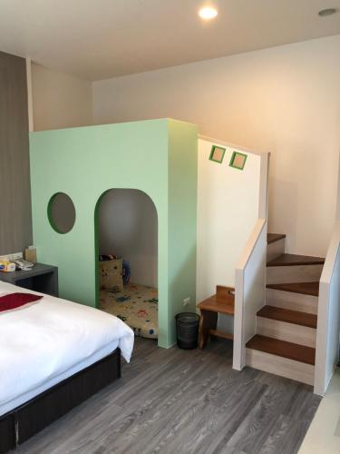 Postel nebo postele na pokoji v ubytování Kai Cheng Inn 旅館134