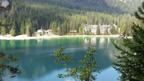 a view of a lake with a resort at Hotel Gran Pre in San Vigilio Di Marebbe
