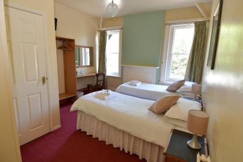 Un pat sau paturi într-o cameră la The Inn On The Green