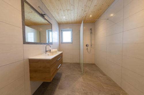 a bathroom with a sink and a shower at Schorpenhof in Fügenberg