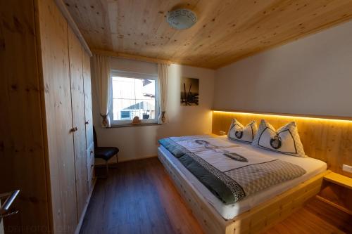 מיטה או מיטות בחדר ב-Schorpenhof
