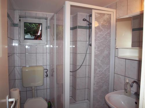 Ванна кімната в Újsziget Vendégház