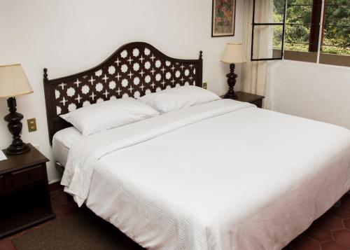 Cama o camas de una habitación en Hotel Mi Ranchito
