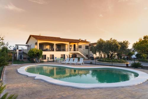 a swimming pool in front of a house at Can Gual in La Ametlla