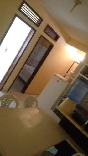 a view of a room with a window and a kitchen at Prainha Apart-Hotel in Baía da Traição