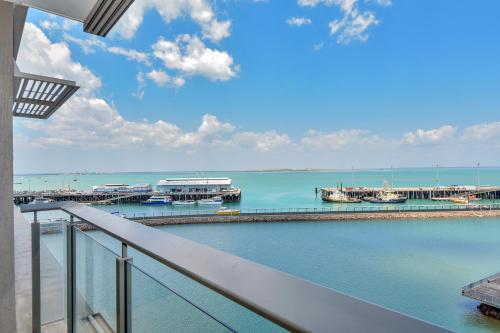 a balcony with a view of a marina at Darwin Waterfront Short Stay Apartments in Darwin