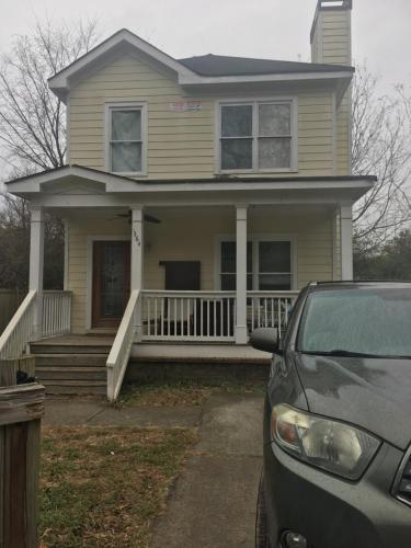 a house with a car parked in front of it at A Room for You! in Atlanta