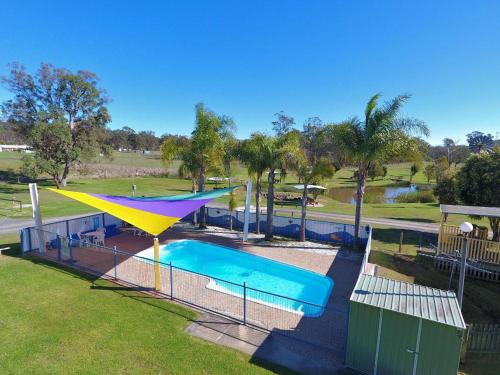 an overhead view of a swimming pool with a slide at Crows Nest Tourist Park in Crows Nest