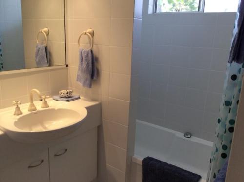a bathroom with a sink and a shower at Ulysses 10 in Mission Beach