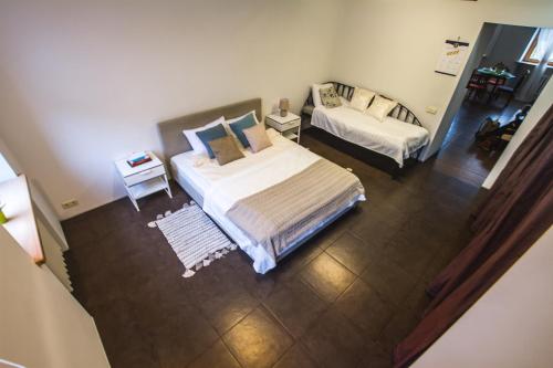 an aerial view of a bedroom with two beds at SPACIOUS 3 ROOM CENTRAL APARTMENT 56d in Kaunas