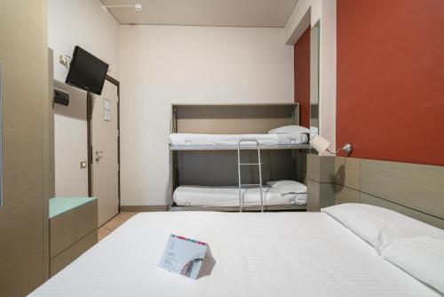 Postel nebo postele na pokoji v ubytování Hotel Palace