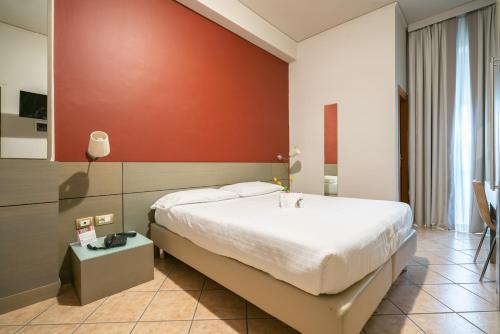 Postel nebo postele na pokoji v ubytování Hotel Palace