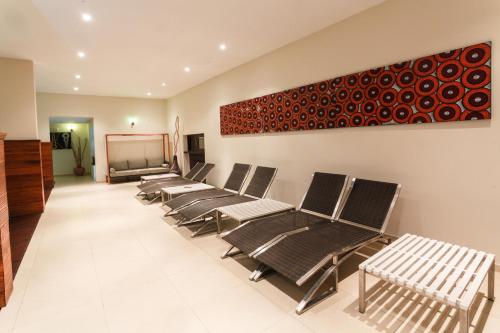 a row of chairs in a waiting room at Calypso Hôtel in Toamasina