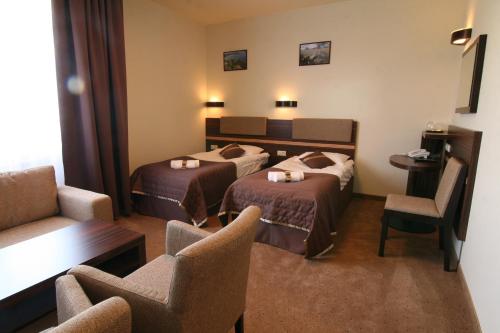 Voodi või voodid majutusasutuse Hotel nad Wigrami toas