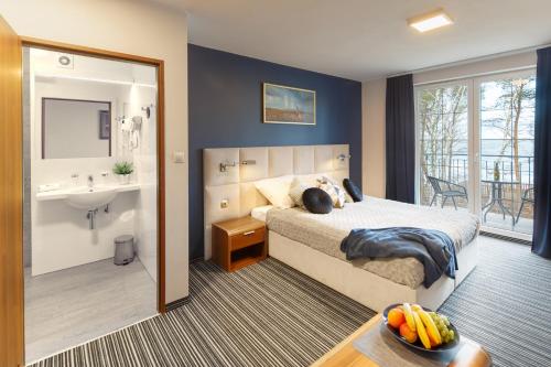Tempat tidur dalam kamar di Villa Dune
