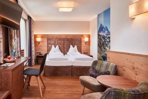 Postel nebo postele na pokoji v ubytování Hotel Neue Post