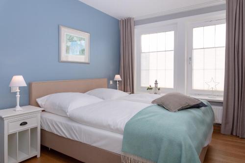 Postel nebo postele na pokoji v ubytování Weisse Düne - App.. 4