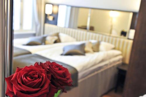 Ένα ή περισσότερα κρεβάτια σε δωμάτιο στο Hotel Red & Green