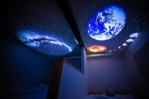 a room with a window with planets on it at Inari Ohan in Kyoto