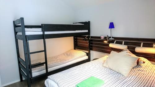 a bedroom with two bunk beds and a bed at Chalet Taube in Bad Gastein