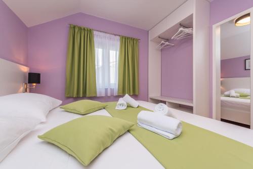 Postel nebo postele na pokoji v ubytování Villa Zdenka