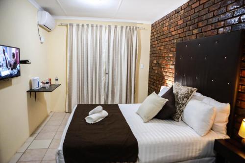 Katil atau katil-katil dalam bilik di Gracious Lodge