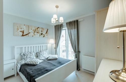 Posteľ alebo postele v izbe v ubytovaní Apartamenty NAVIGATOR-PORT VIEW