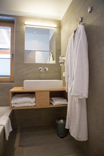 a bathroom with a sink and a mirror at Sportappartements in Bad Mitterndorf