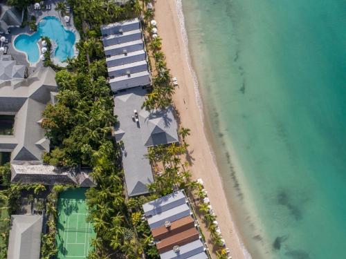 an overhead view of the beach and the ocean at Carlisle Bay in Old Road