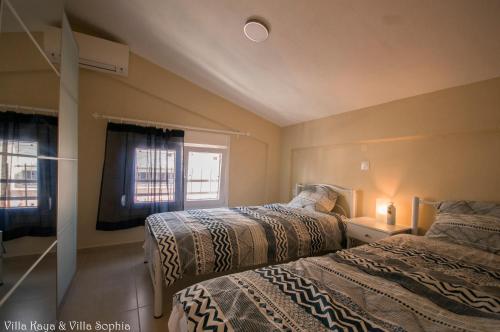 Postel nebo postele na pokoji v ubytování Villa Kaya & Villa Sophia