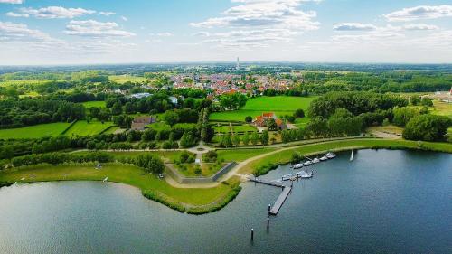 an aerial view of a park next to a body of water at Hotel Crasborn Thorn in Thorn