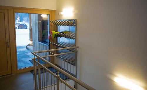 a parrot is sitting on a rack in a room at Sportappartements in Bad Mitterndorf