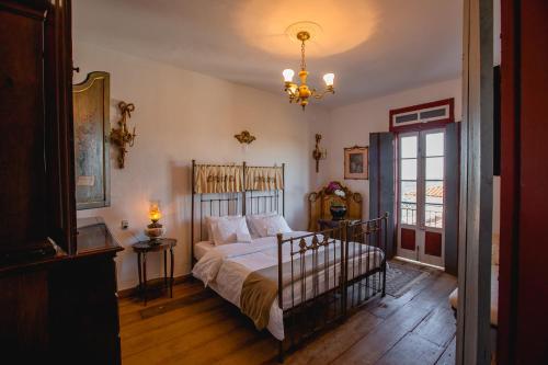 Cama ou camas em um quarto em Hotel Vila Relicário