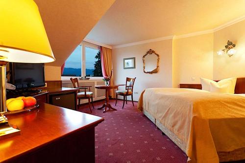 Ένα ή περισσότερα κρεβάτια σε δωμάτιο στο Hotel Am Rehberg garni