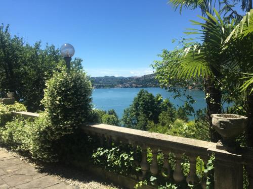 a view of a lake from a fence at B&B Villa Costanza in Blevio