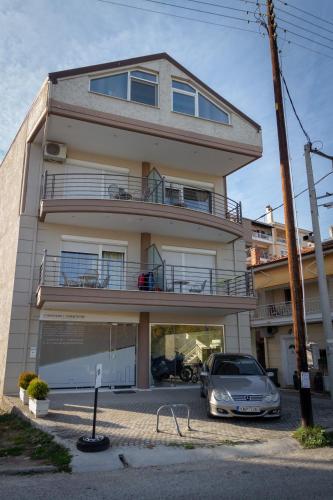 a building with a car parked in front of it at Filareti studios in Kastoria